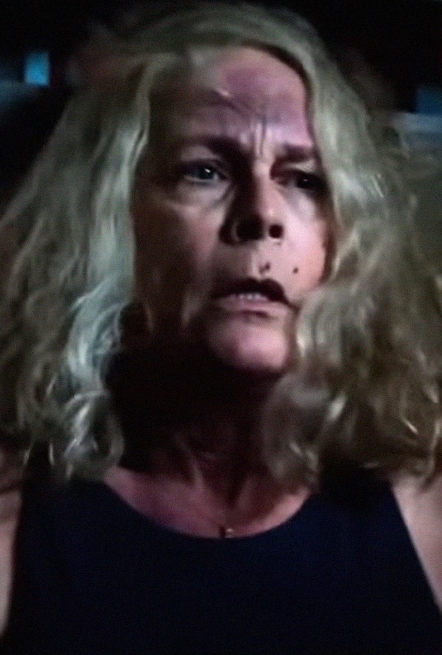 Jamie Lee Curtis scared with bloody marks all over her face