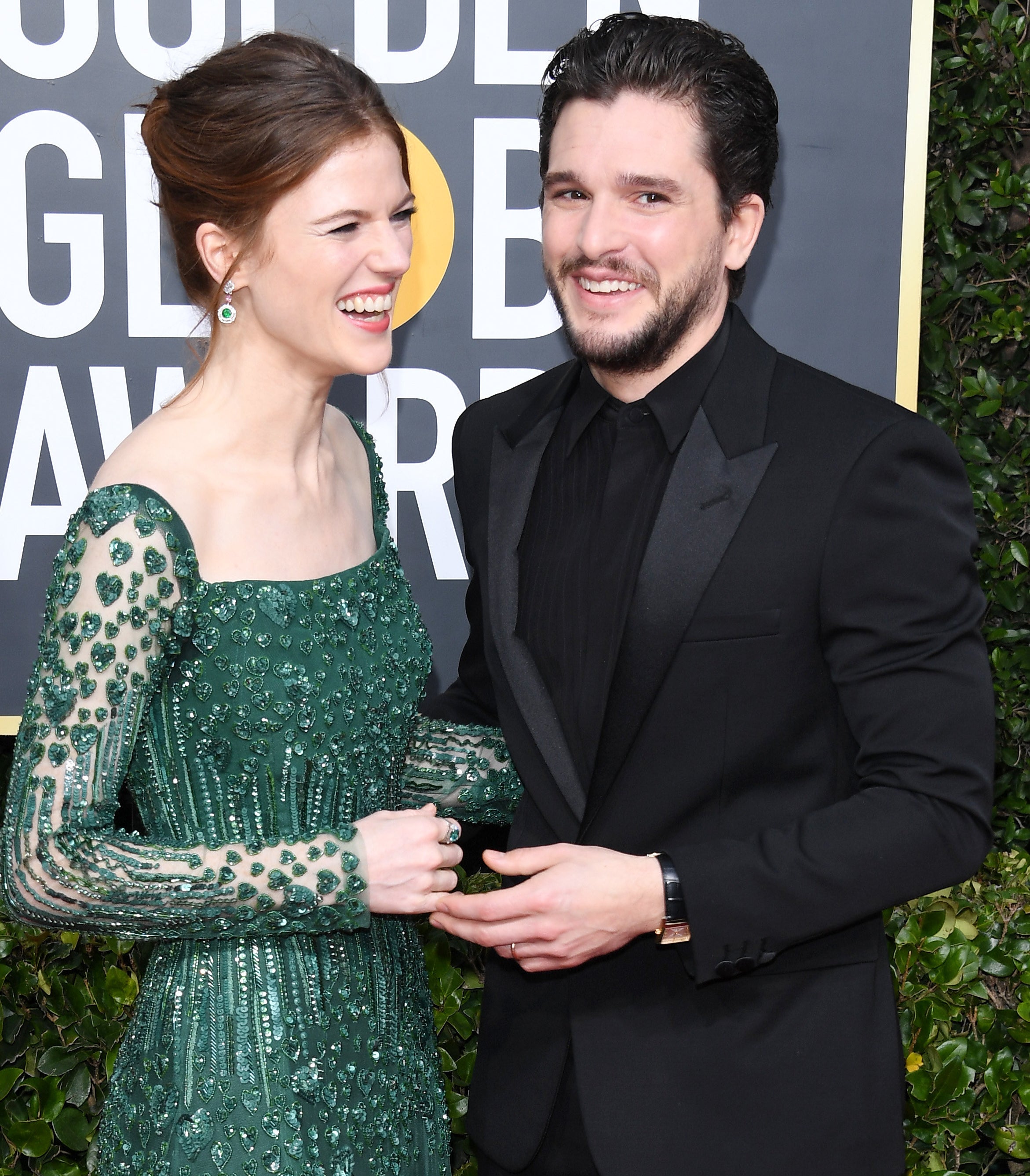 Rose Leslie in beaded gown with Kit Harington in 3-piece suit at Golden Globe Awards