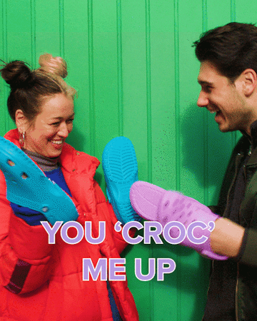 People high-fiving with Crocs