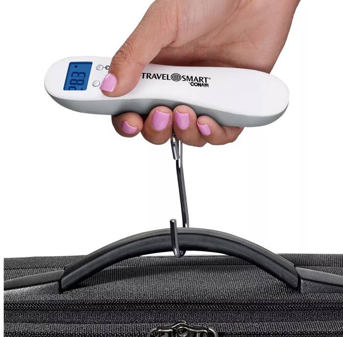 the scale weighing a piece of luggage