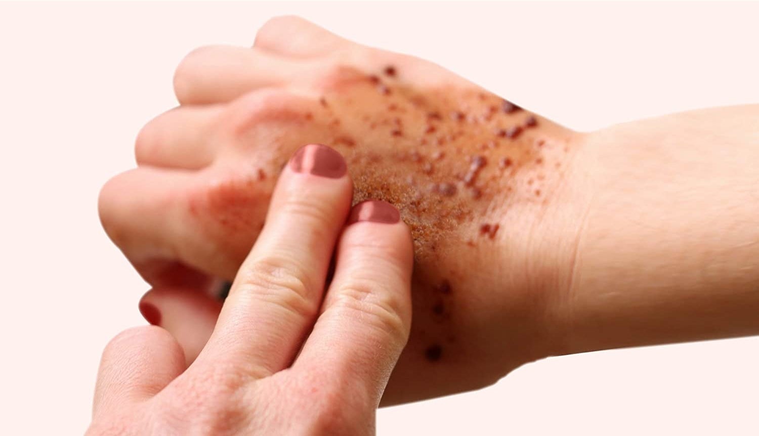A person using the scrub on the back of their hand