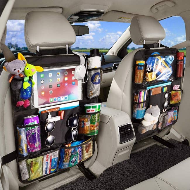 the organizers installed in a car and filled with snacks, toys, and more