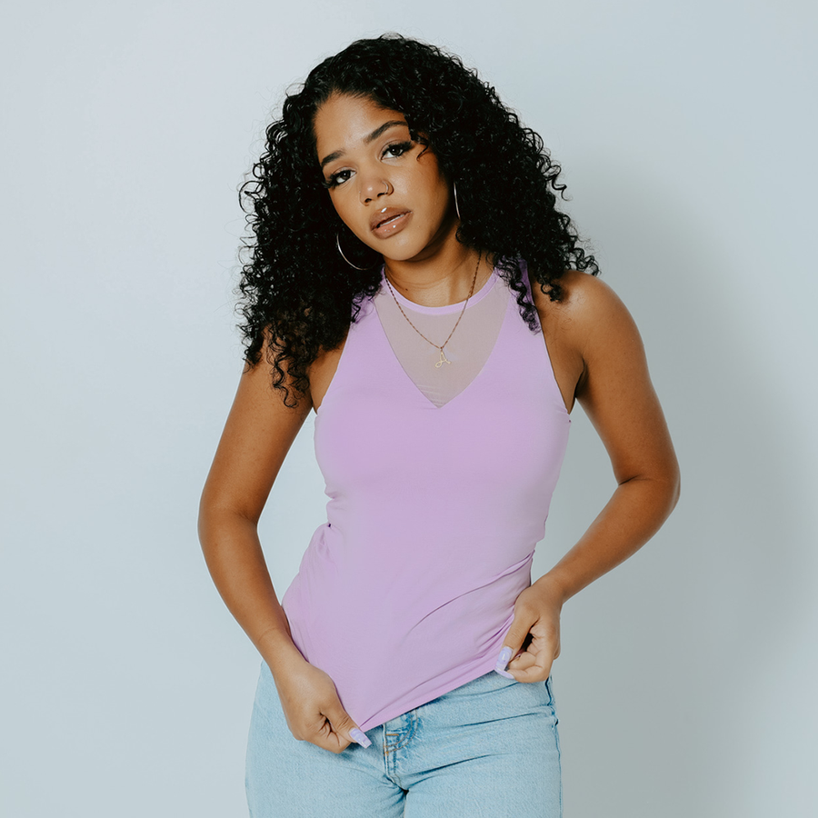 model wearing the tank top in lilac with v-neck mesh panel