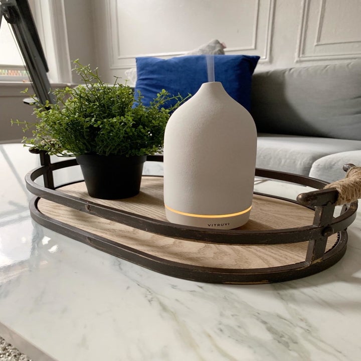 the stone diffuser on a coffee table in white