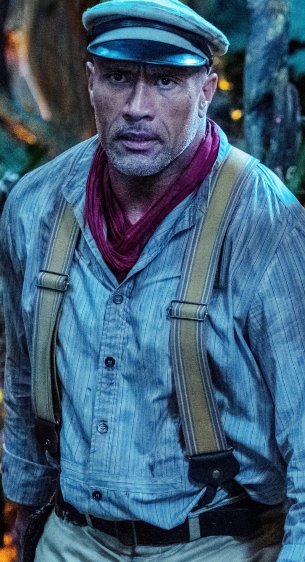 Dwayne &quot;The Rock&quot; Johnson wearing a cap, suspenders, and a button-up shirt