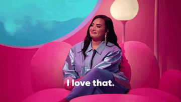 gif of demi lovato sitting on a love seat that reads I love that