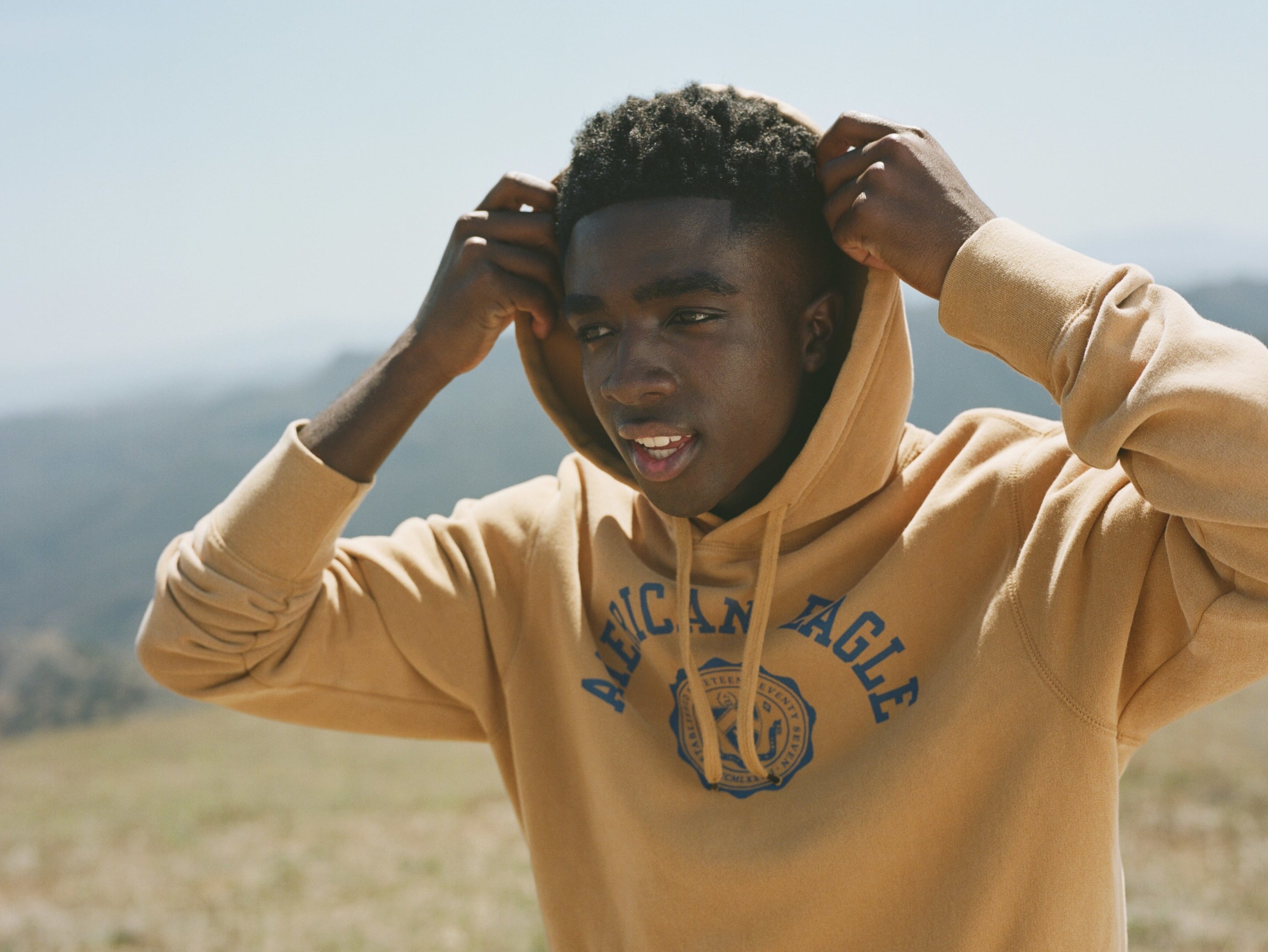 Model wearing American Eagle Super Soft Fleece Graphic Hoodie