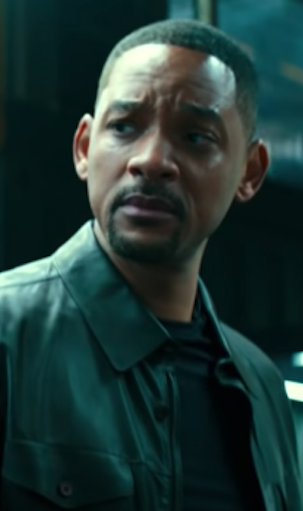 Will Smith looking confusingly at Martin Lawrence, wearing a leather jacket