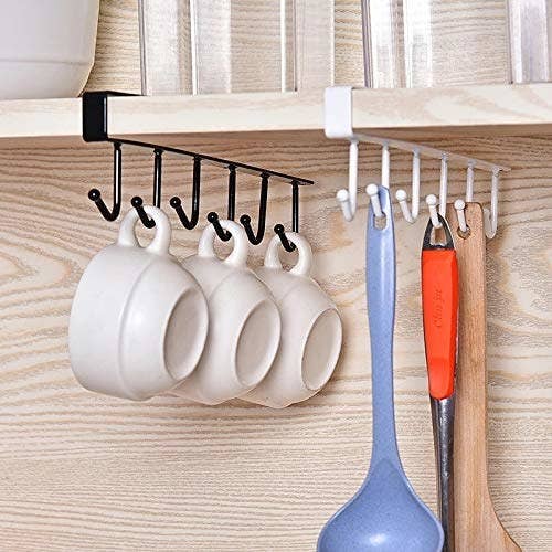 Mugs and spatulas hanging off the hook organiser