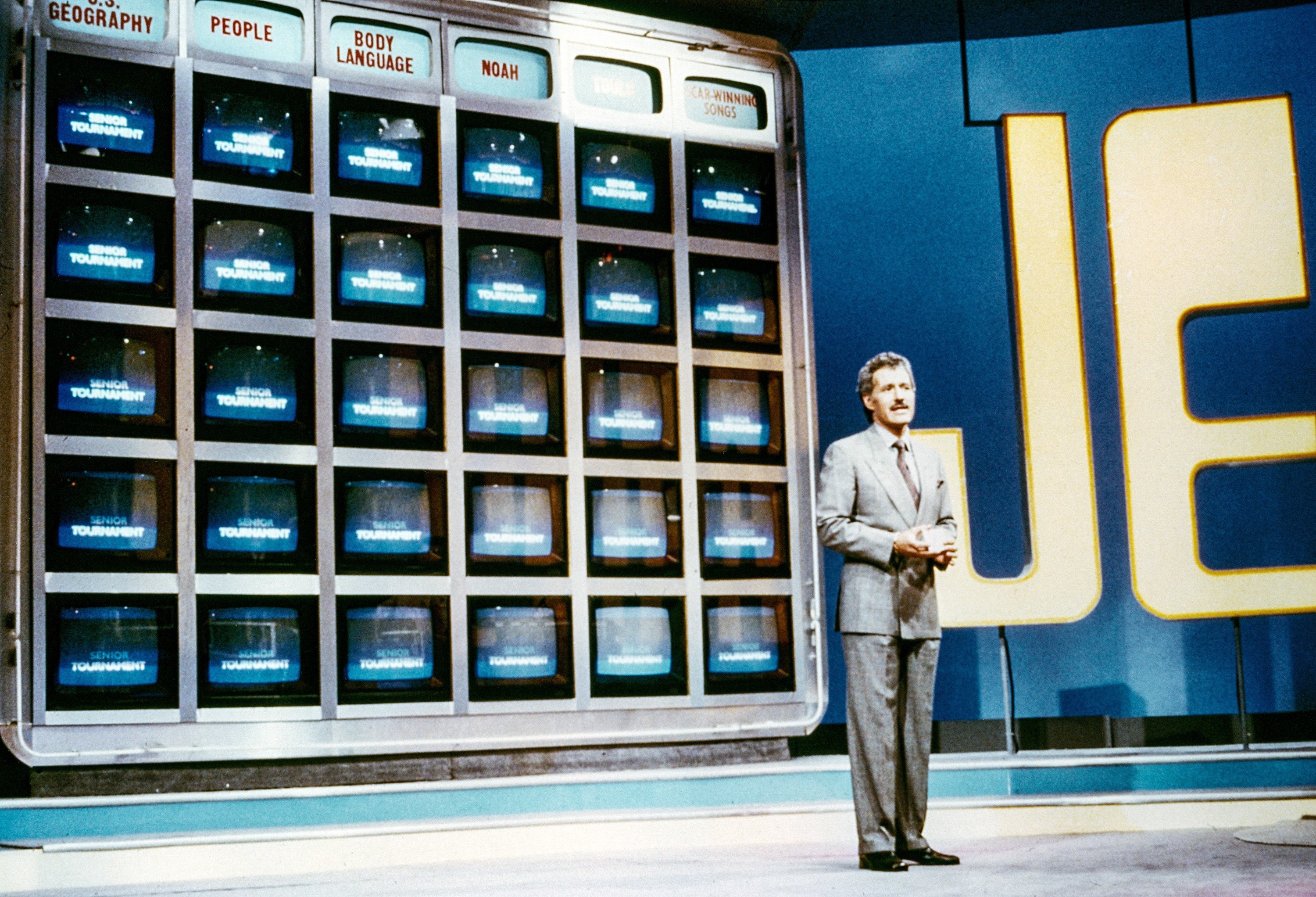 Alex Trebek hosting Jeopardy in the 1980s