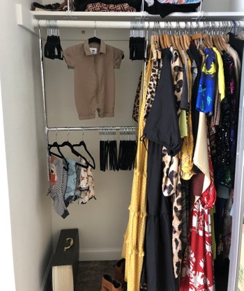 A closet is shown with the double hanging rod