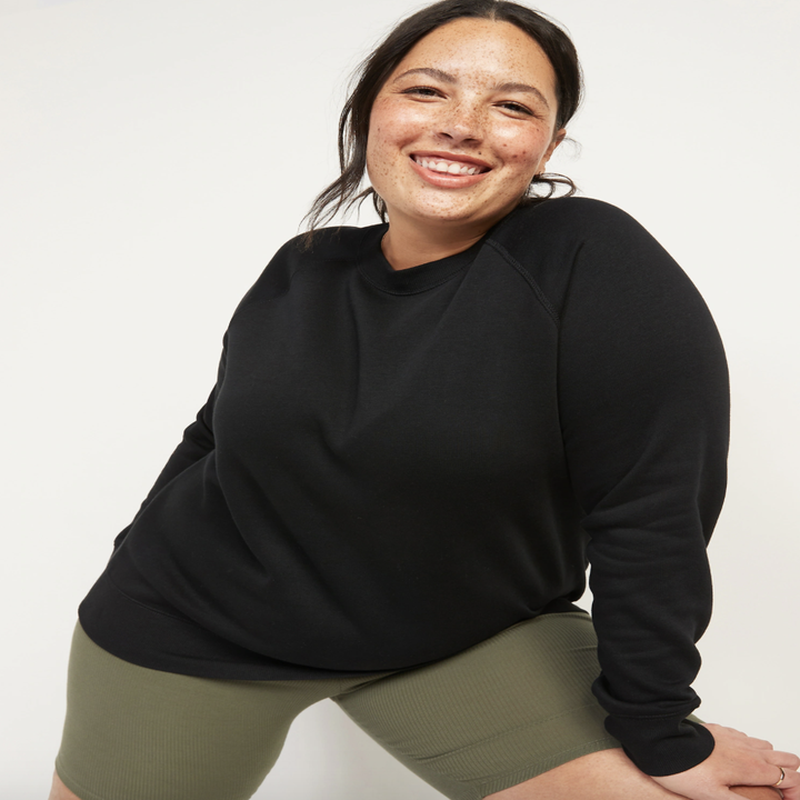 Model in a black crewneck sweater 