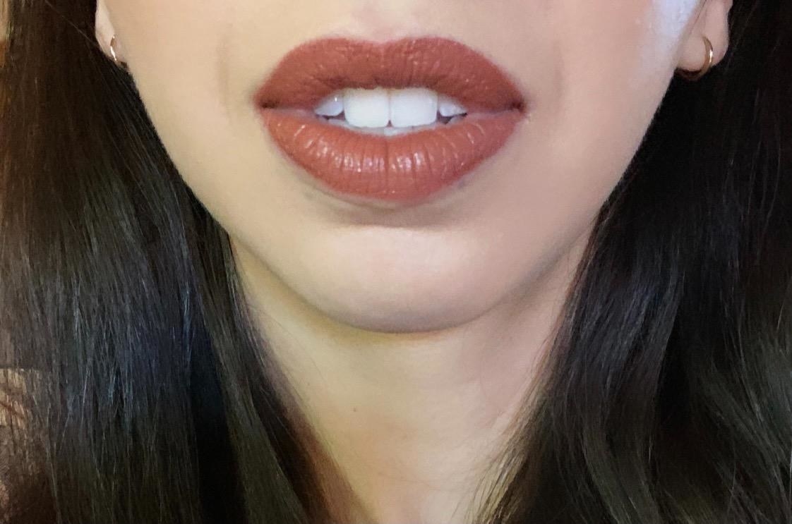 close-up of a reviewer wearing the shade amazonian