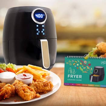 the cheat sheet next to an air fryer and a plate of food