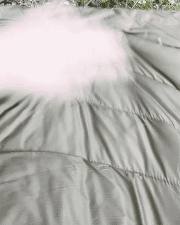 gif of the writer easily brushing crumbs off of the blanket