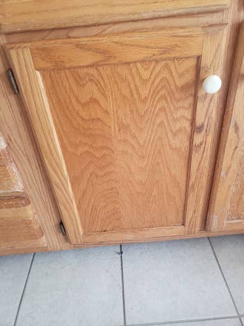 reviewer after image of the same cabinet door, polished and unscratched 