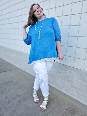 reviewer wearing the top in blue with white trim 