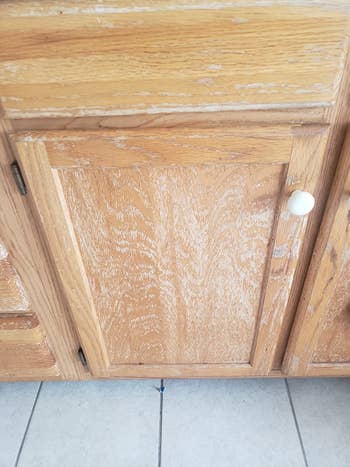 reviewer before image of a dull and scratched cabinet door