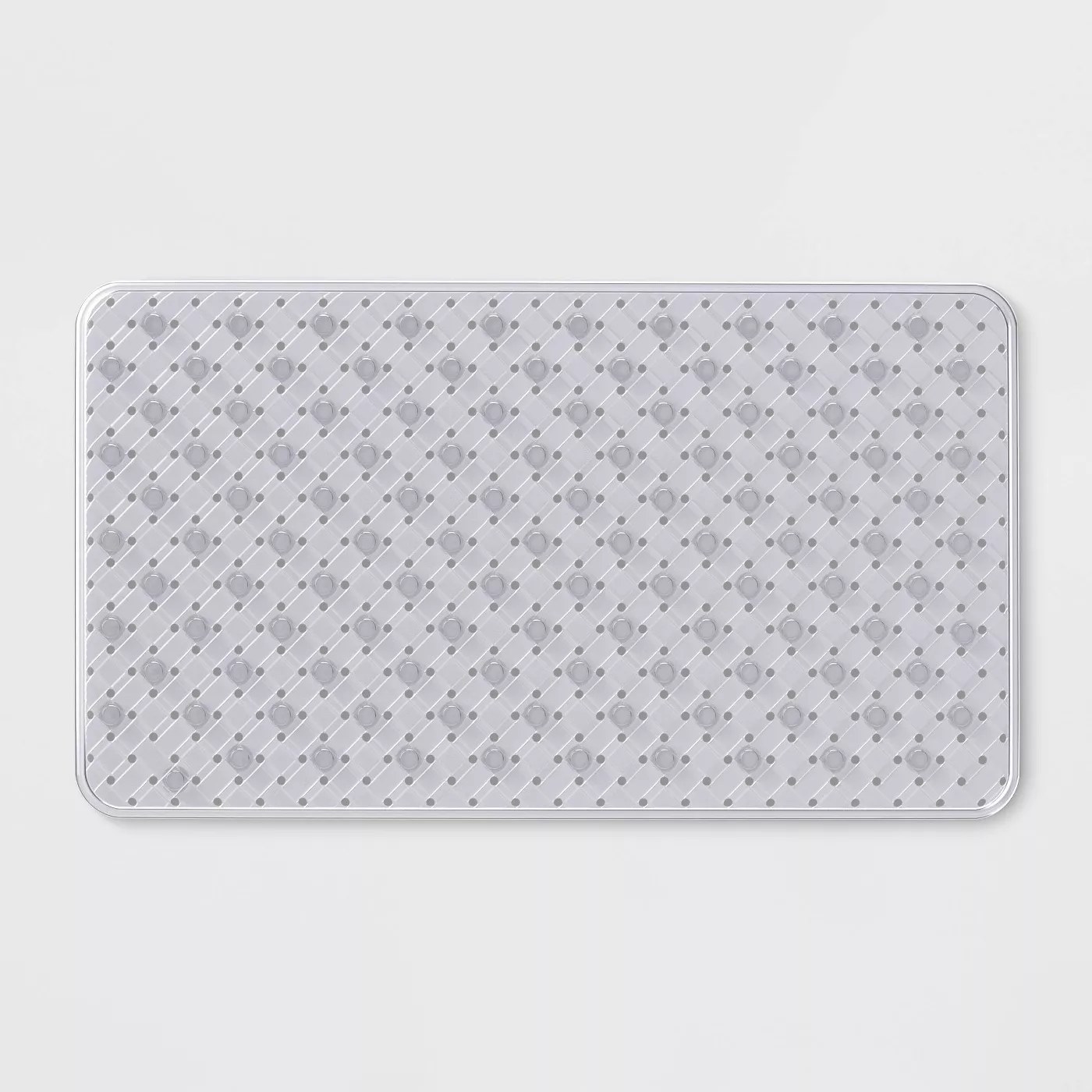 The clear bath mat has beautiful woven detailing and is in a large rectangular shape