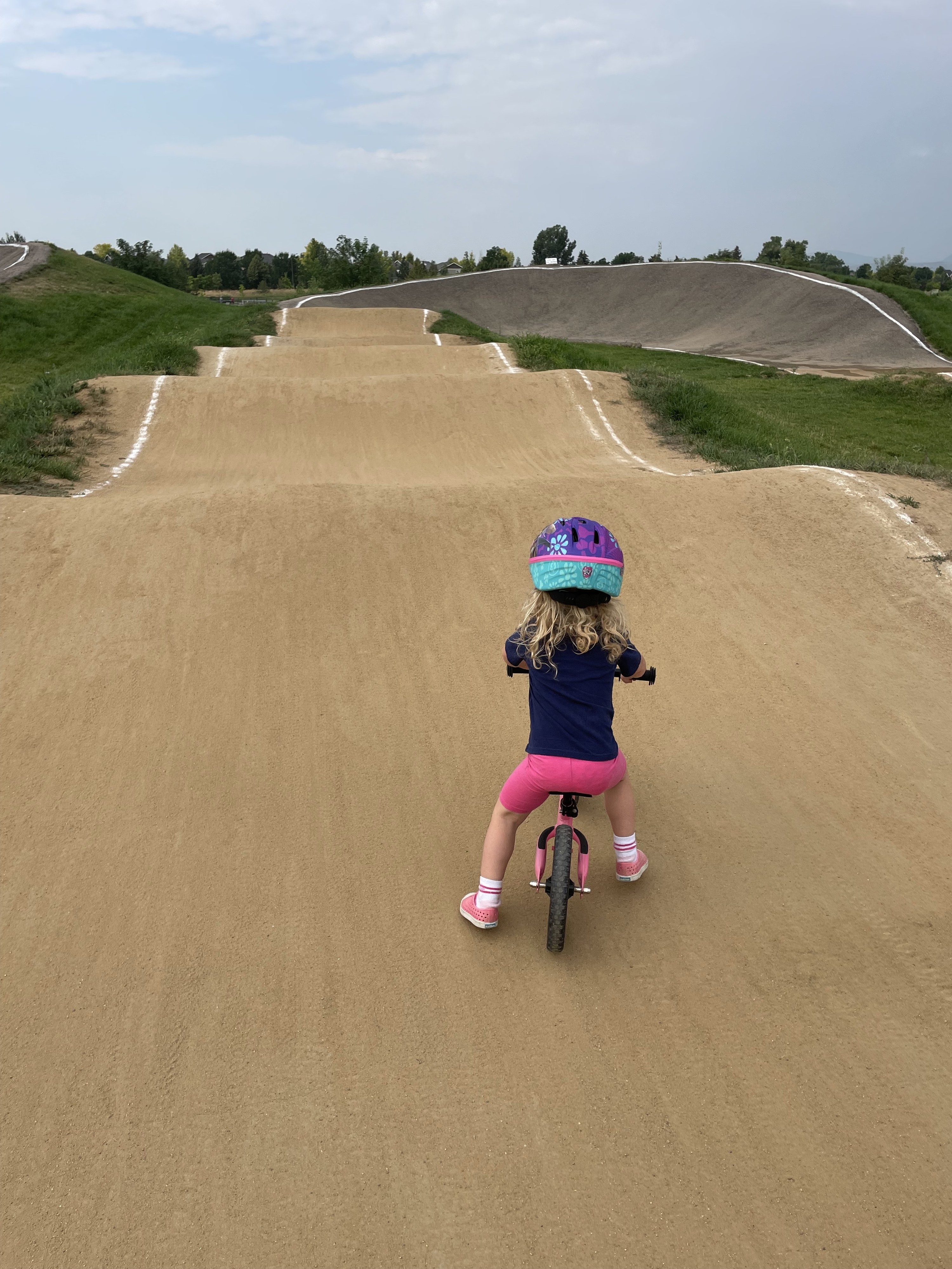 The author&#x27;s daughter riding a bike