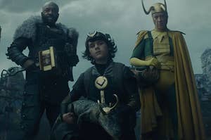 Boastful Loki and Older Loki stand behind Kid Loki who cradles Alligator Loki in his lap