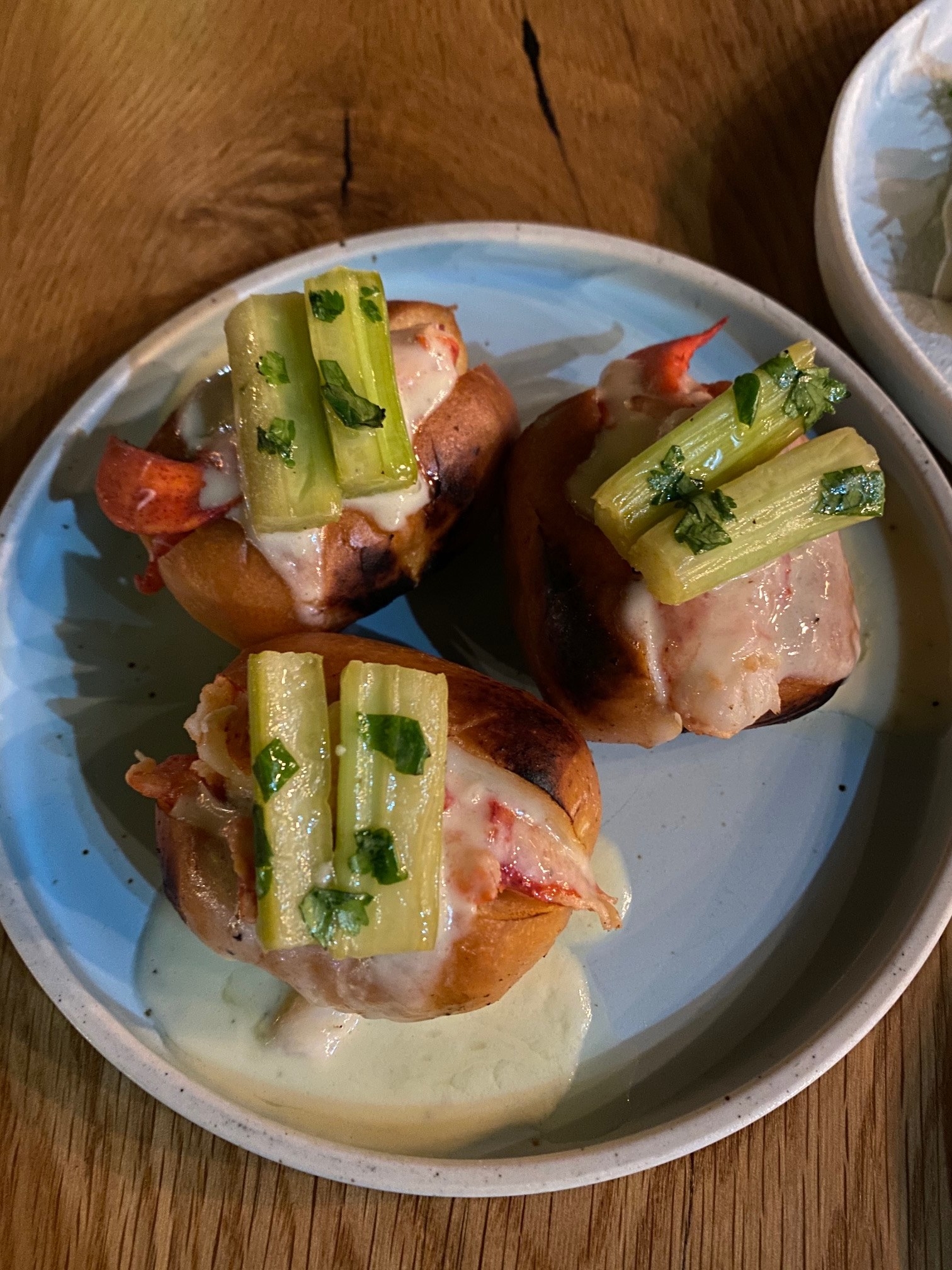 Mini lobster rolls with celery and creamy truffle sauce
