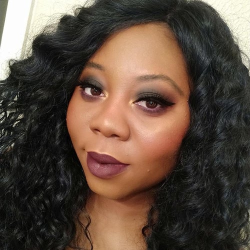 reviewer wearing a dark purple shade