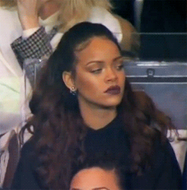 Rihanna looking over slowly annoyed