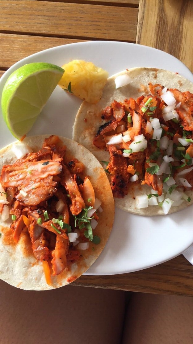 A plate of two al pastor tacos