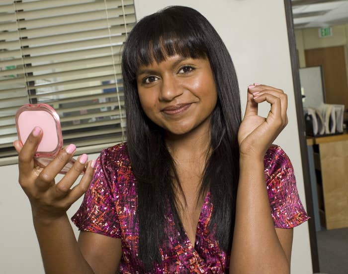 Mindy poses as Kelly in a promo photo from the office