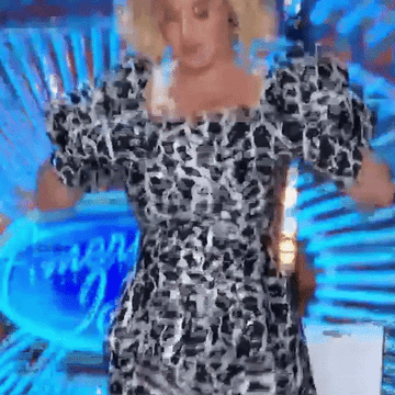 GIF of katy perry ripping down shirt