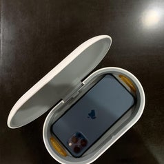 reviewer photo of open UV phone sanitizer with phone inside