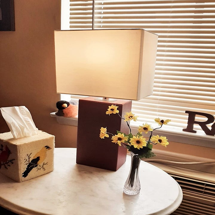 the leather wrapped table lamp in a deep red