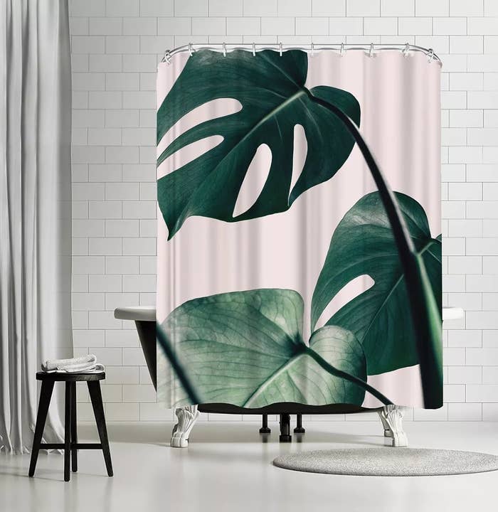 The pink shower curtain with monstera leaves