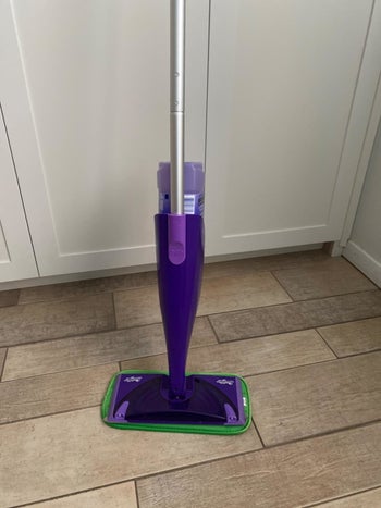 Reviewer photo of a green pad on Swiffer WetJet