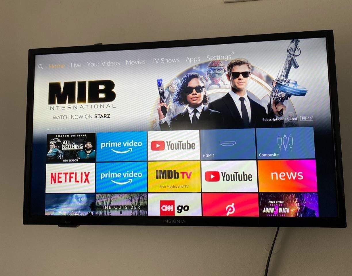 Large tv mounted on reviewer&#x27;s wall