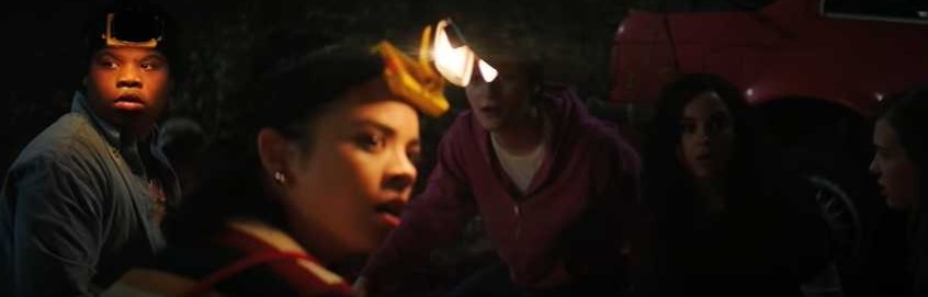 Group of friends with headlamps on look rattled