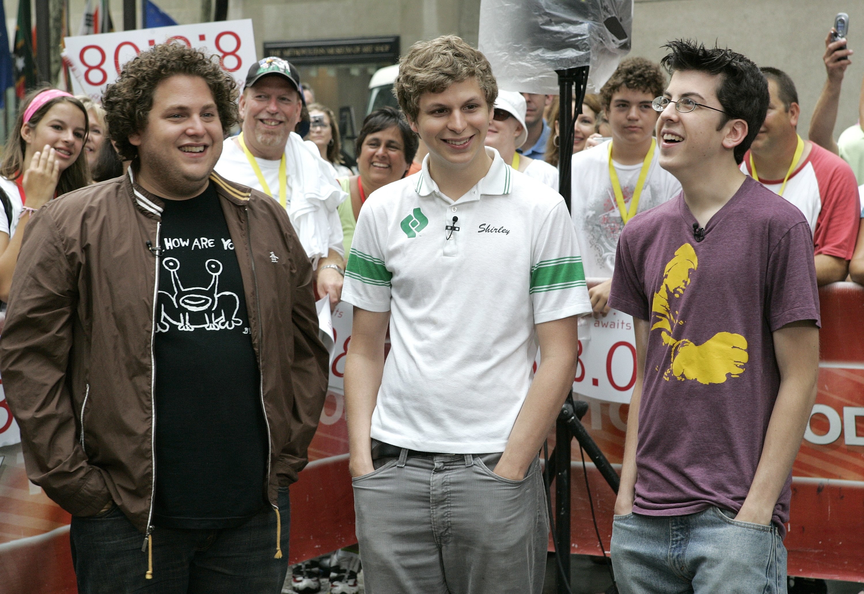 Jonah Hill, wearing a jacket and with hands in his pocket, stands with fellow &quot;Superbad&quot; cast members Michael Cera and Christopher Mintz-Plasse