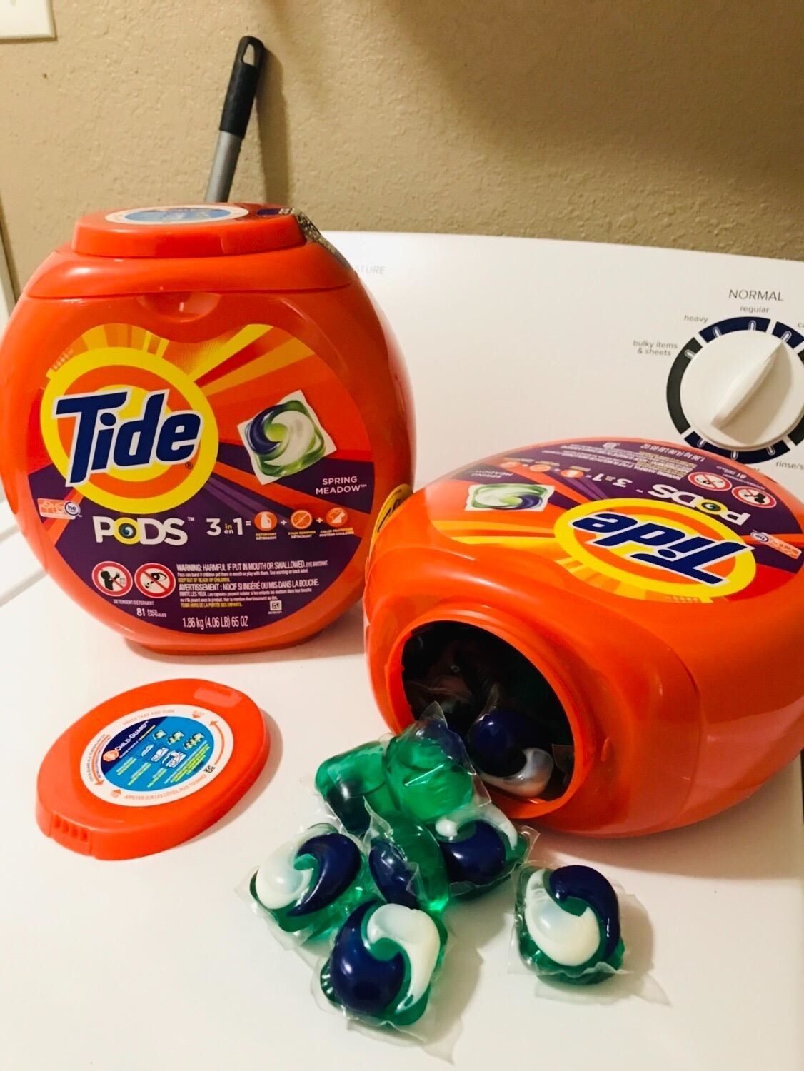 Two boxes of tide pods on white table