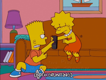 Bart and Lisa Simpson play tug of war with the TV remote