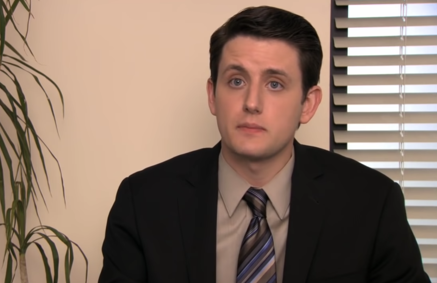 Zach Woods as Gabe Lewis talking to the camera in the office