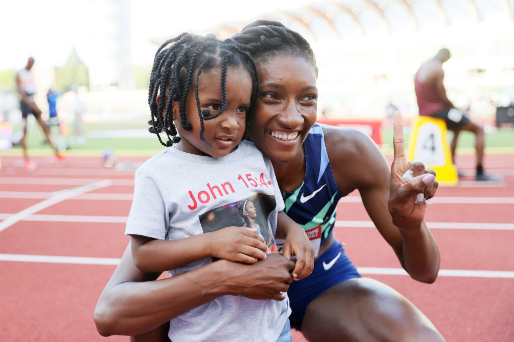 Quanera Hayes celebrates with her son Demetrius after finishing first in the Women's 400 Meters Final at the 2020 U.S. Olympic Track &amp;amp; Field Team Trials