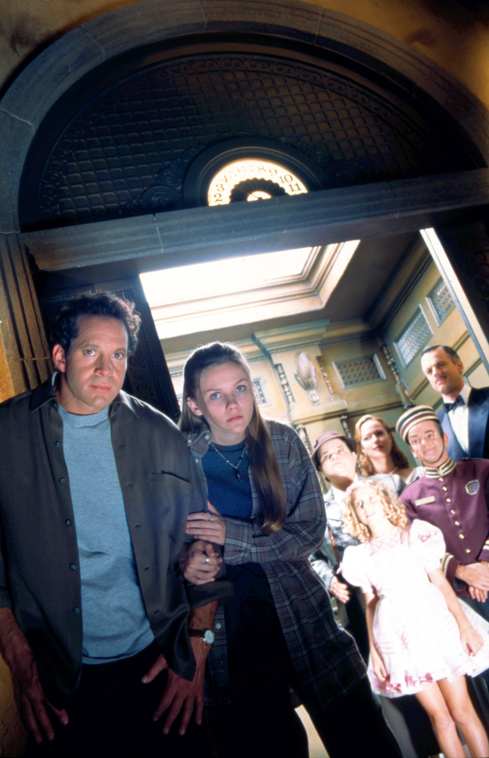 promo shot for the film with Buzzy and Anna outside the elevator of the five ghosts from the hotel