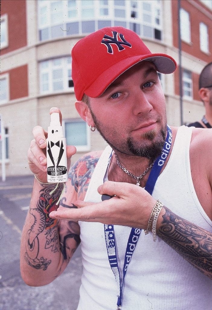 Fred Durst reacts to red Yankees cap thrown on stage 