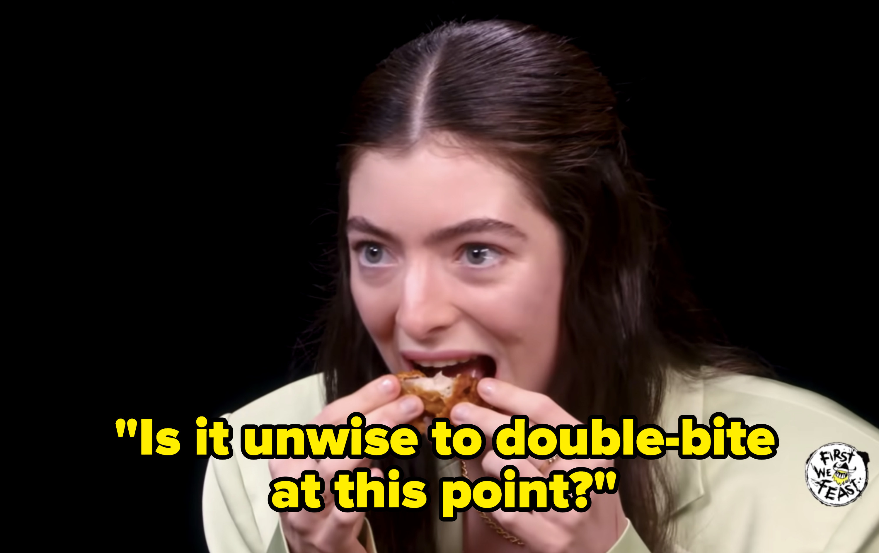 Lorde biting into her wing again and asking, &quot;is it unwise to double bite at this point?&quot;