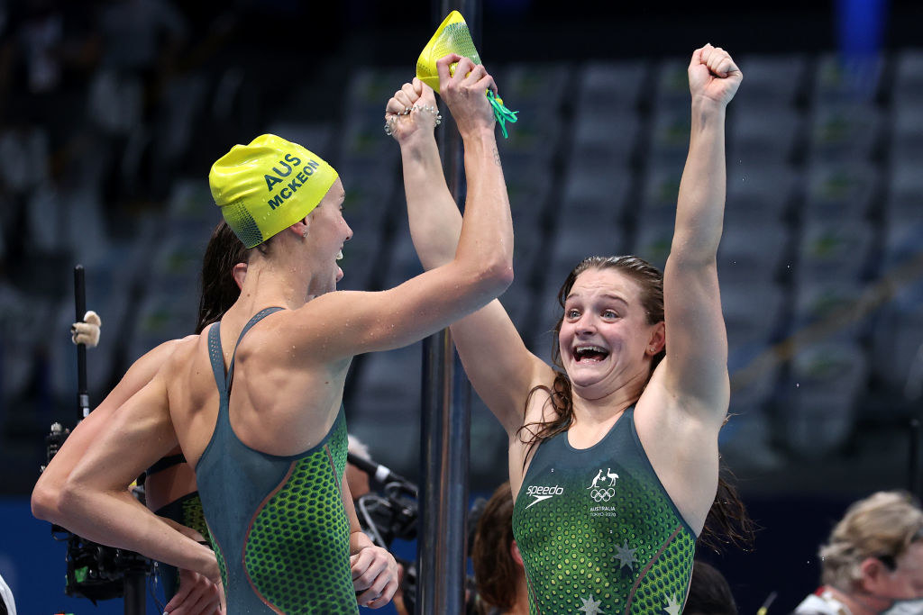 Emma McKeon and Chelsea Hodges of Team Australia react after winning the gold medal and breaking the olympic record for the Women&#x27;s 4 x 100m Medley Relay Final
