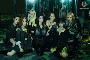 Dreamcatcher poses in a room full of mirrors