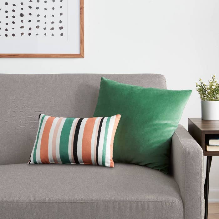 Stripped pillow on grey couch