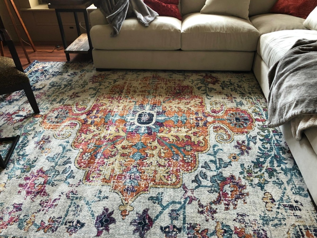 the reviewer&#x27;s photo of the artistic weaver rug