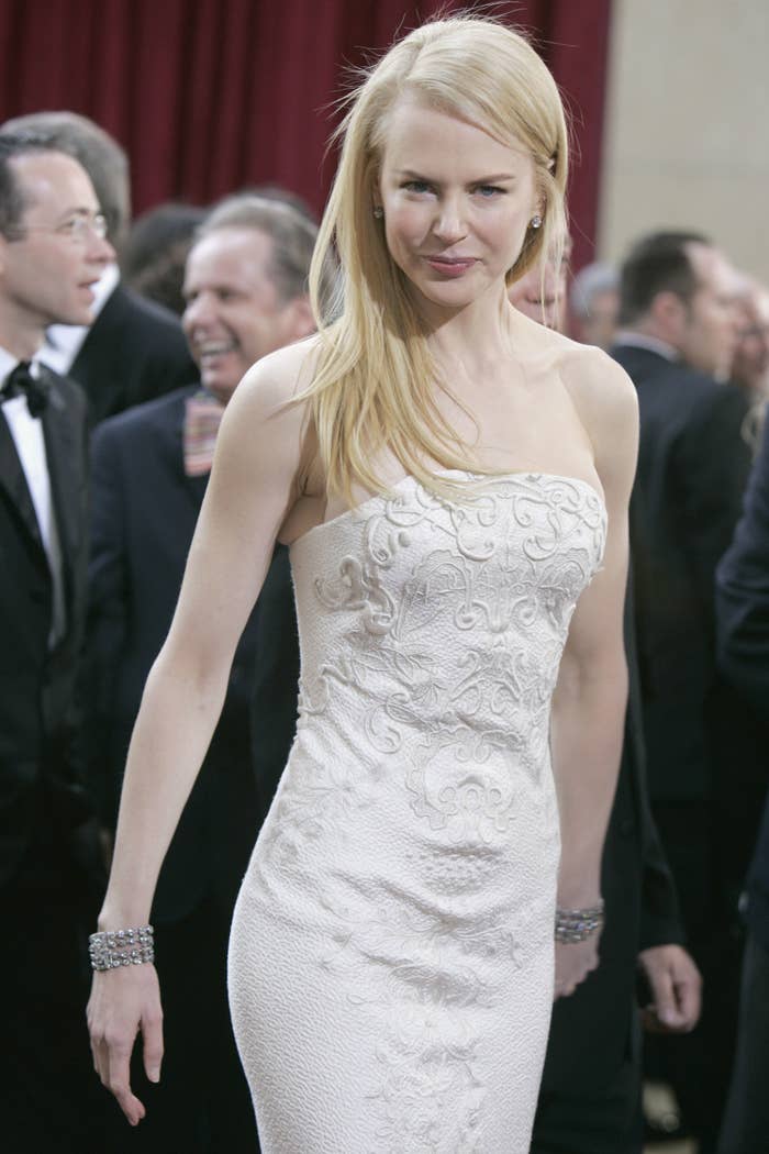 Nicole in a textured strapless gown and diamond bracelets on each wrist at the Oscars